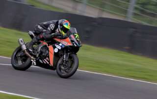 An image of sponsored biker, Rhys Stephenson, racing in round 1 at Oulton Park.